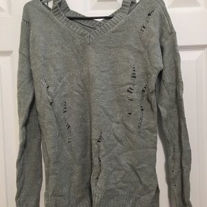 Gray sweater. Ripped design new.